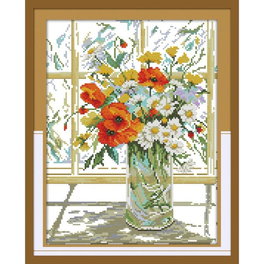 Flower vase on windowsill