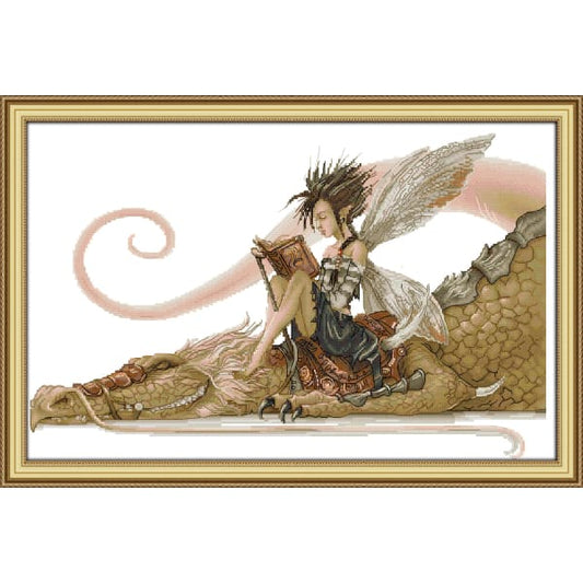 The girl sat on the dragon reading a book